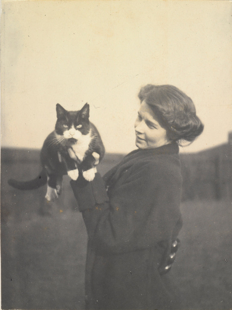 Detail of An informal photograph of Kathleen Alice Taylor holding Slabbie the black/white cat in her hands by unknown