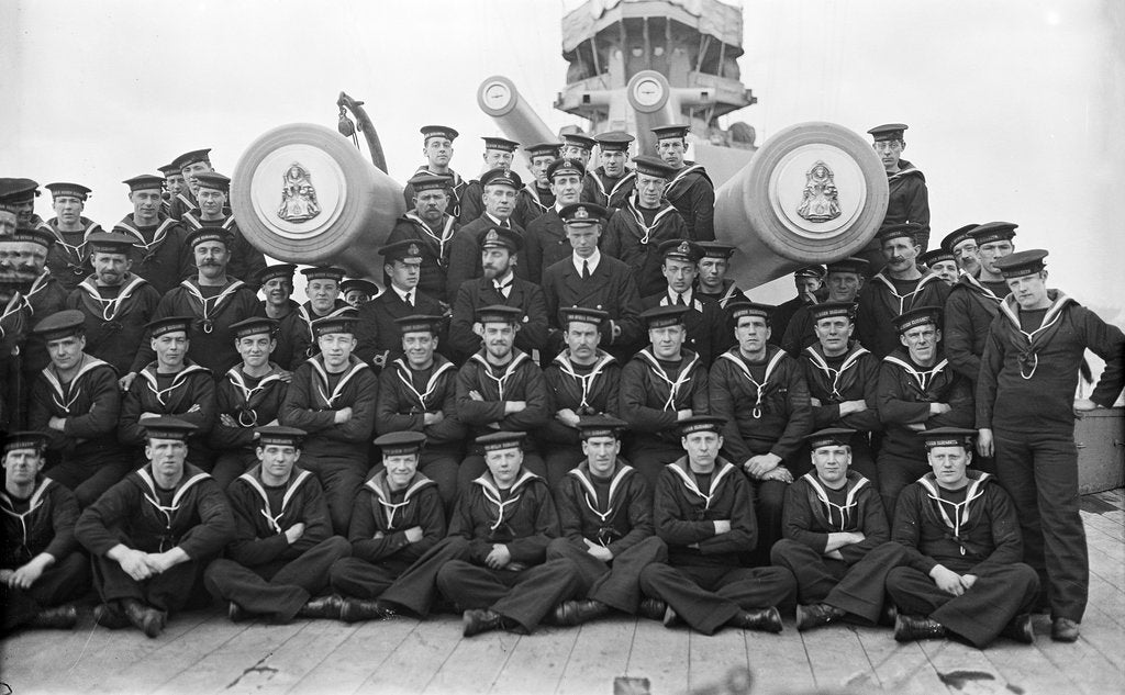 Detail of The gun crew of 'A' turret on the forecastle with the barrels of the turret projecting through the group of 'Queen Elizabeth' (1913) by unknown