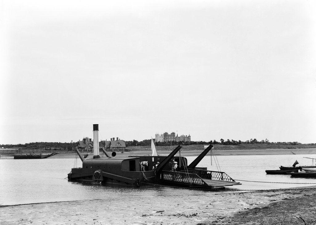 Detail of The steam chain ferry 'Lady Quilter' (1894) on the Felixstowe side of the River Deben, with Bawdsey Manor in the background by Smiths Suitall Ltd.