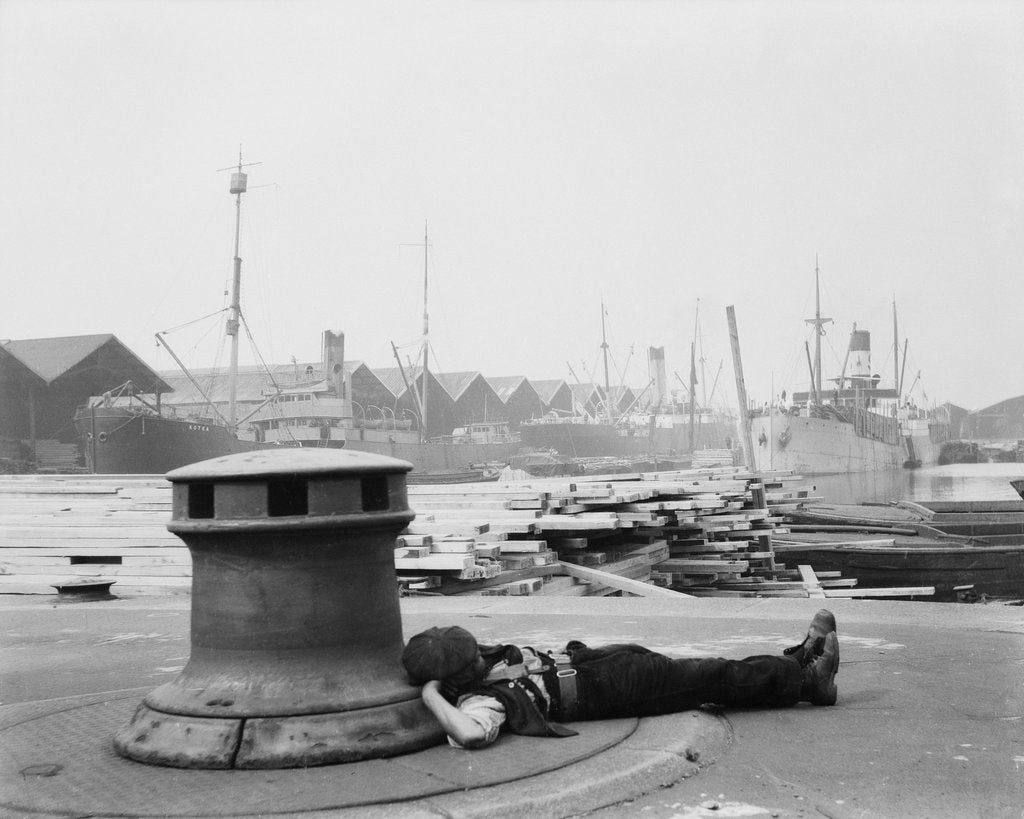 Detail of Man resting at Surrey Commercial Docks by unknown