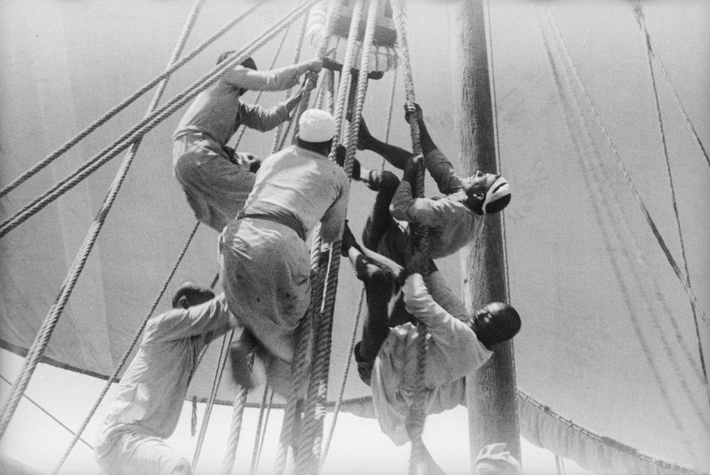 Detail of Sailors climbing the halyard blocks by Alan Villiers