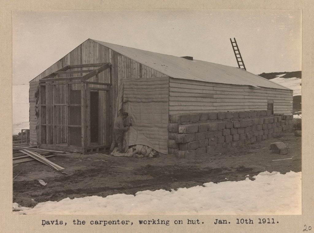 Detail of Davies, the carpenter, working on the hut by Herbert George Ponting