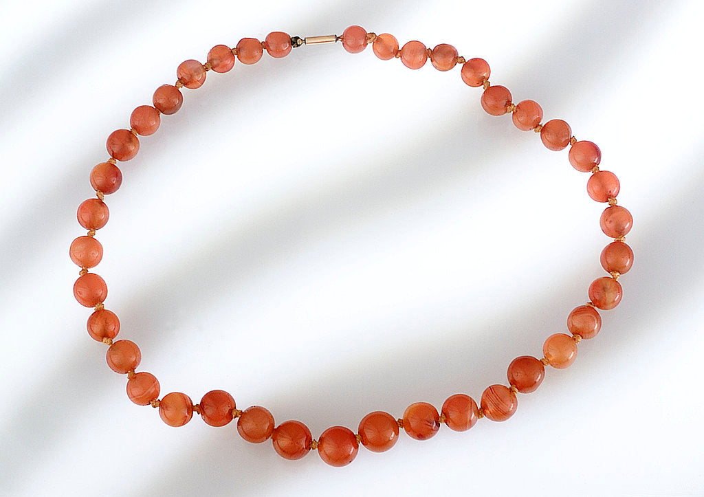 Detail of Amber beads by unknown