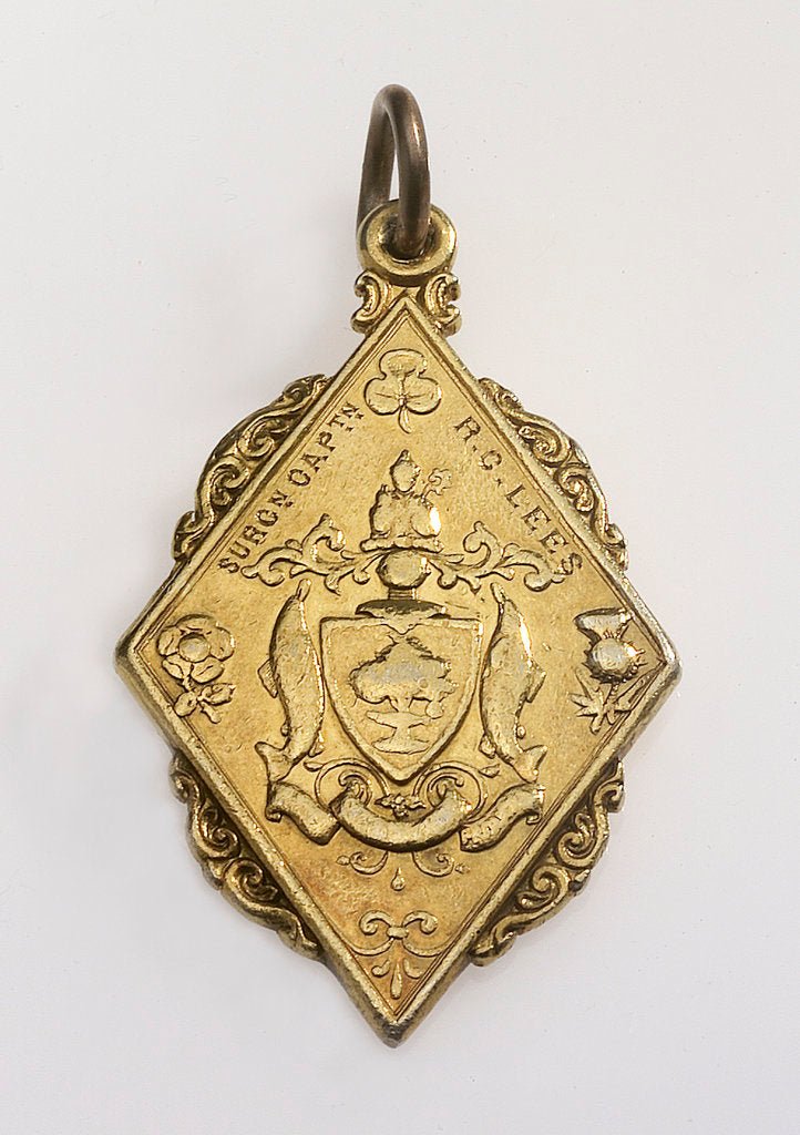 Detail of Flat, gilt metal diamond-shaped pendant by unknown