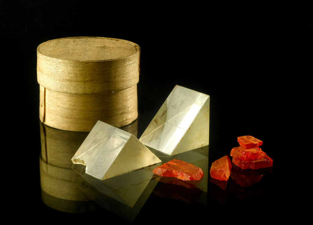 Detail of Pill box containing two prisms and red coloured crystals by unknown