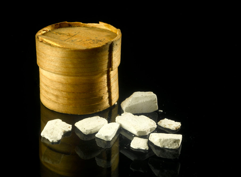 Detail of Pill box containing eight chalky white plaster-like crystals by unknown