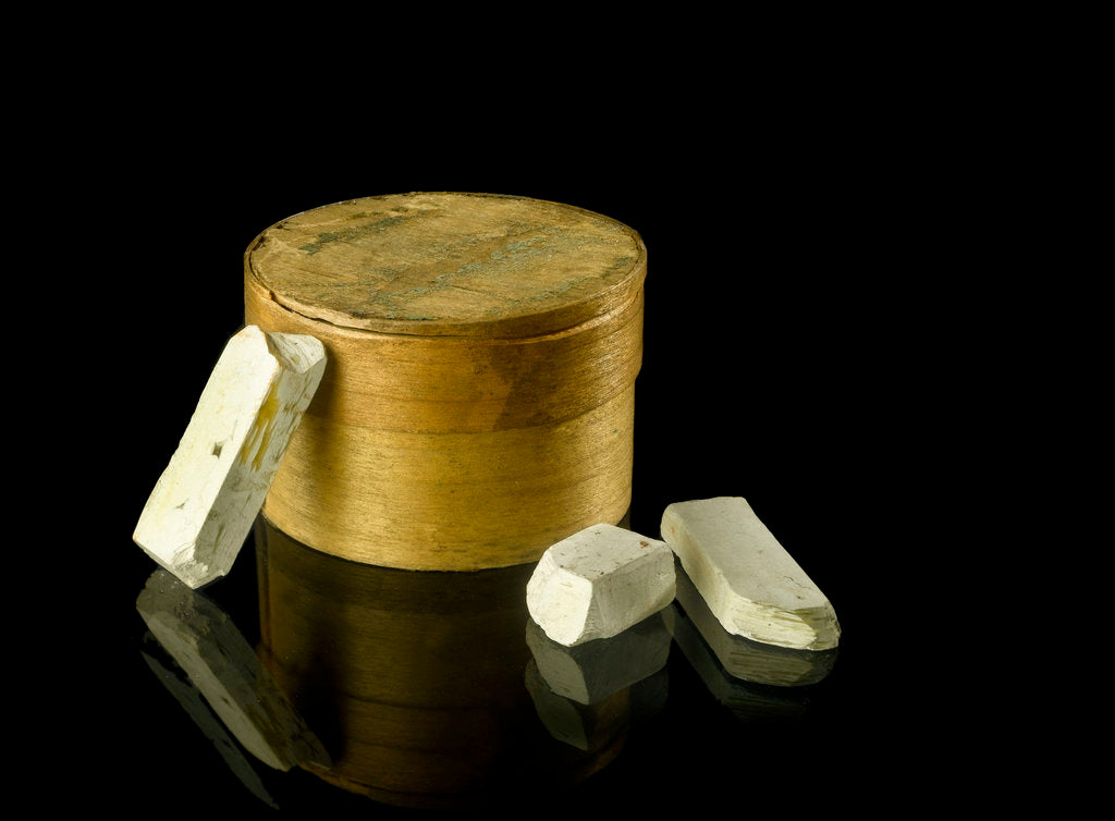 Detail of Pill box containing eight chalky plaster like crystals by unknown
