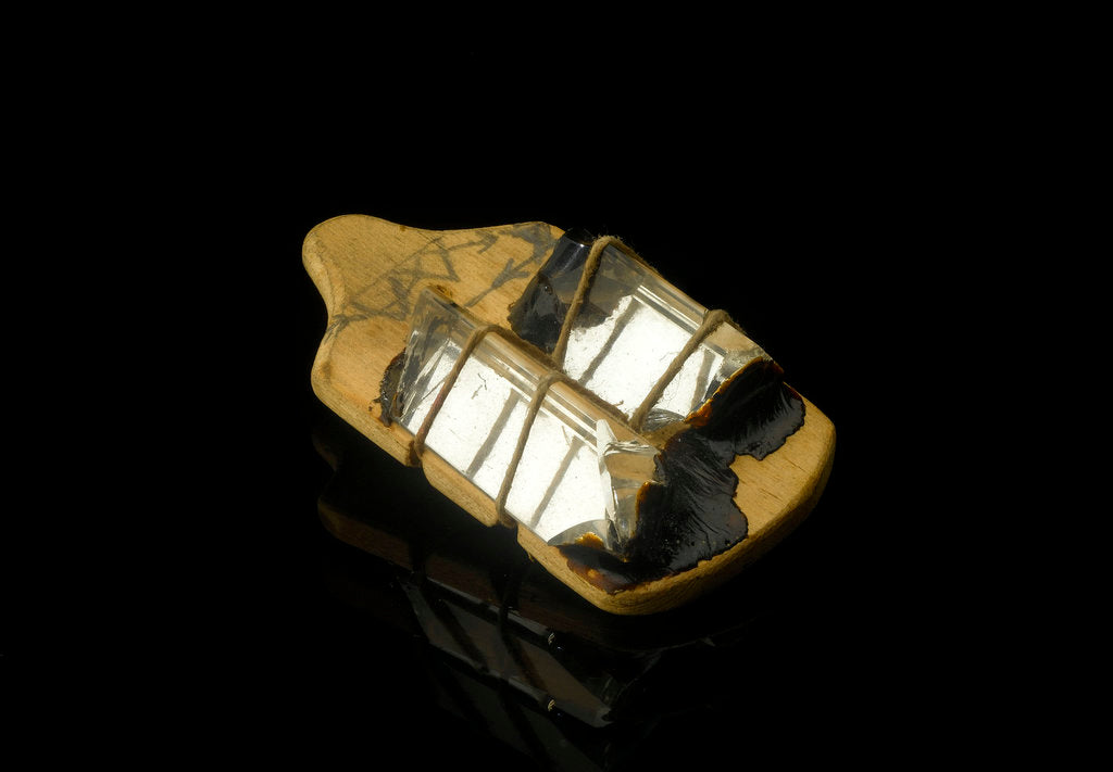 Detail of Two triangular prisms mounted with string and sealing wax on a pinewood baseboard by unknown