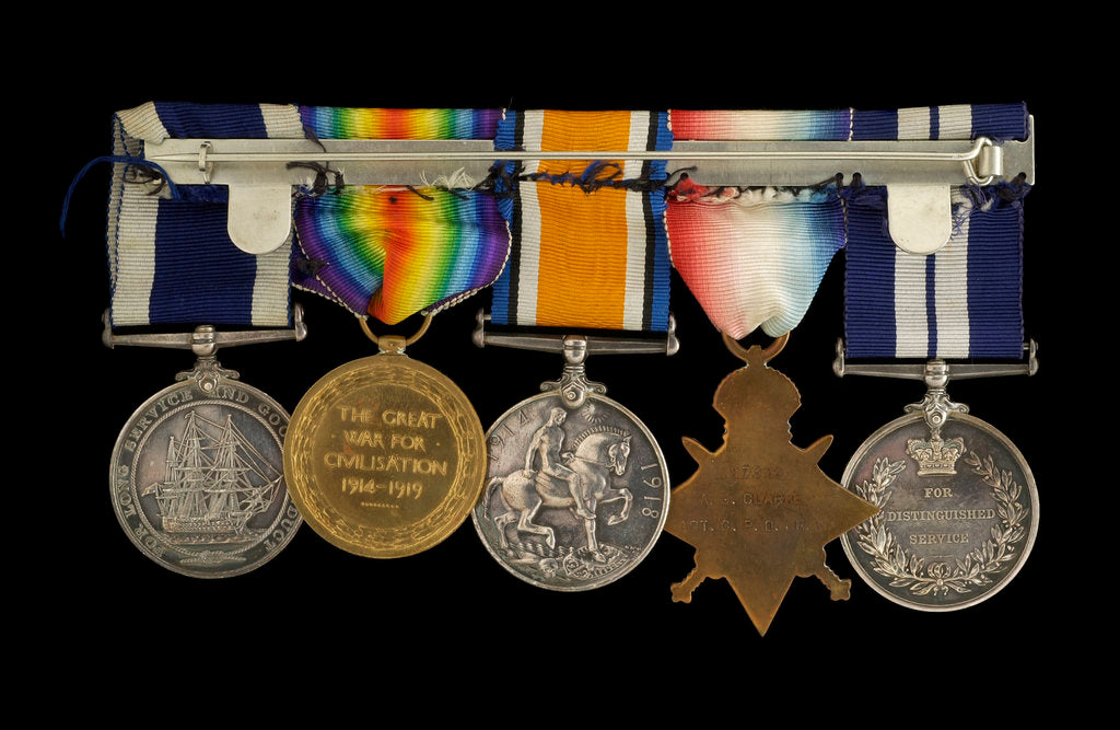 Detail of Medals awarded to Chief Petty Officer A. G. Clarke DSM (reverse, r to l, MED1095-1104) by B. Mackennal