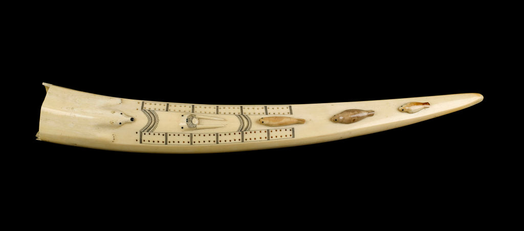 Detail of A cribbage board and two pegs, carved from a walrus tusk with a polar bear, walrus head, and three seals carved in relief by Inuit