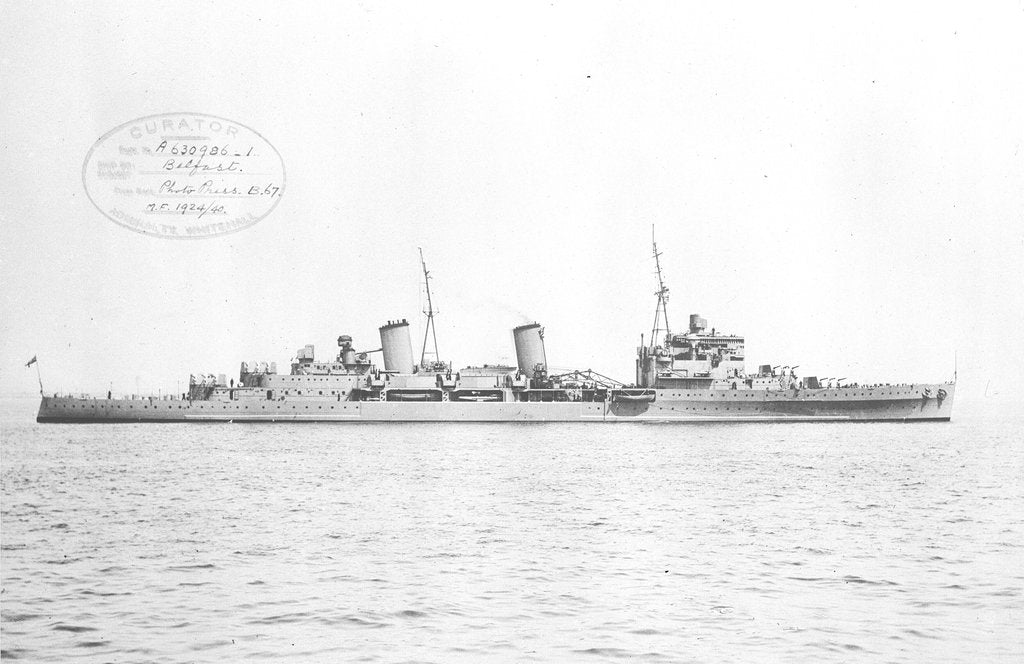Detail of HMS 'Belfast' (1938) topped at Spithead with all guns trained to starboard by unknown