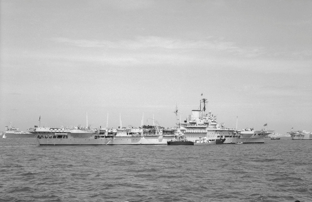 Detail of Aircraft carrier HMS 'Illustrious' (1939) in June 1953, anchored in Line F at Spithead for the Coronation Review. The aircraft lighter 'R.N.AIR' is alongside by unknown