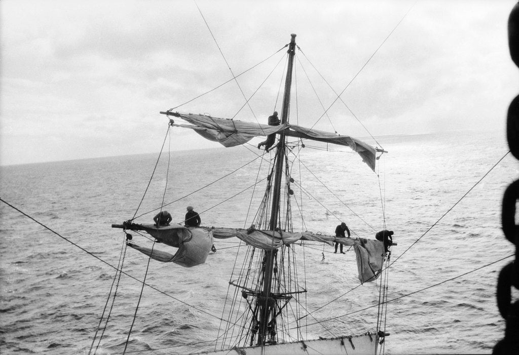 Detail of Aloft on the Mizzen furling the blown-out sails by Alan Villiers