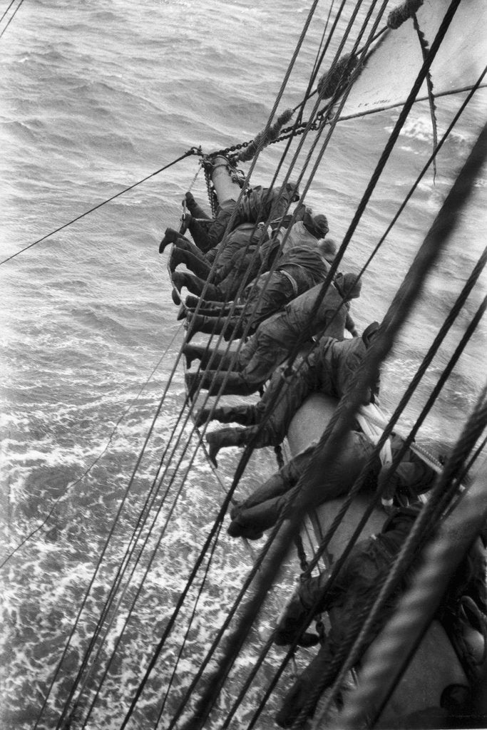 Detail of Making the main sail fast near Cape Horn, swaying on the footrope by Alan Villiers