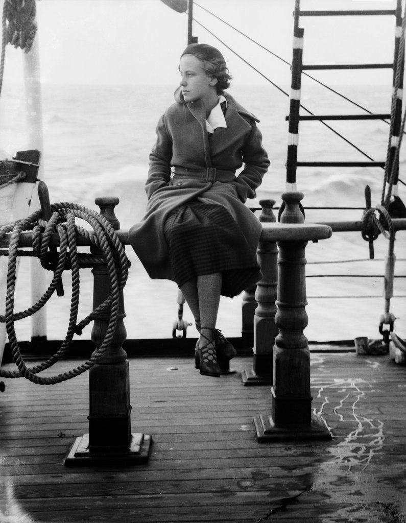 Detail of Elisabeth Jacobsenin shore clothes seated on the poop rail, aboard 4 masted barque 'Parma' (Fi, 1902), ex 'Arrow' (Ruben de Cloux) by Alan Villiers
