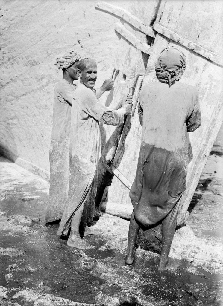 Detail of Sailors applying anti-fouling mixture to the 'Triumph of Righteousness' by Alan Villiers