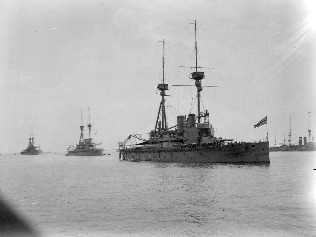 Detail of Battleship HMS 'Agamemnon' (1906) at anchor at Spithead, with awning rigged aft and 'Lord Nelson' astern of her by unknown