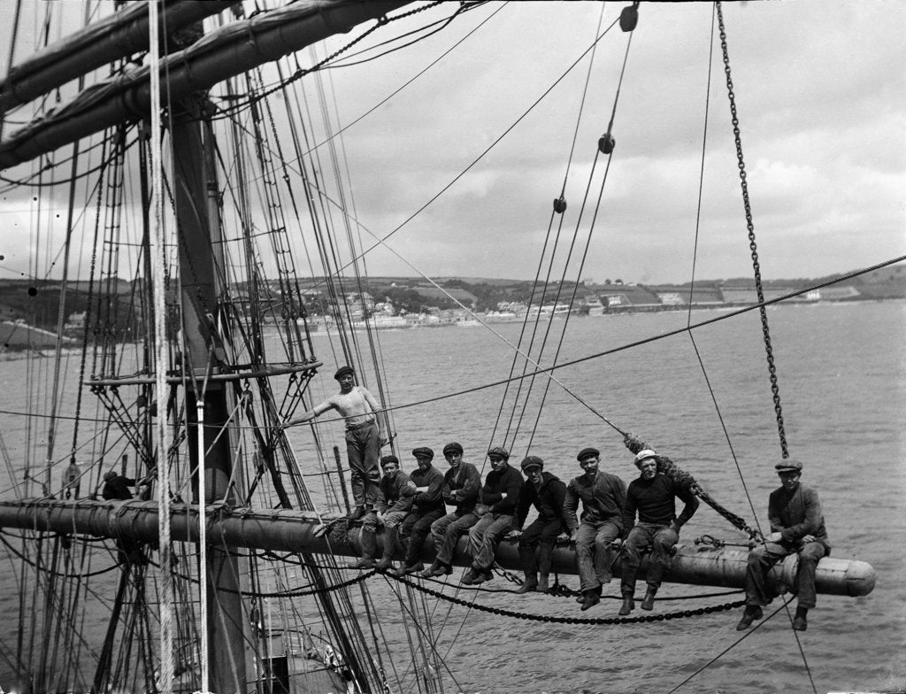 Detail of 'Fahrwohl' 3 masted barque. Crew sitting on the mainyard. by unknown