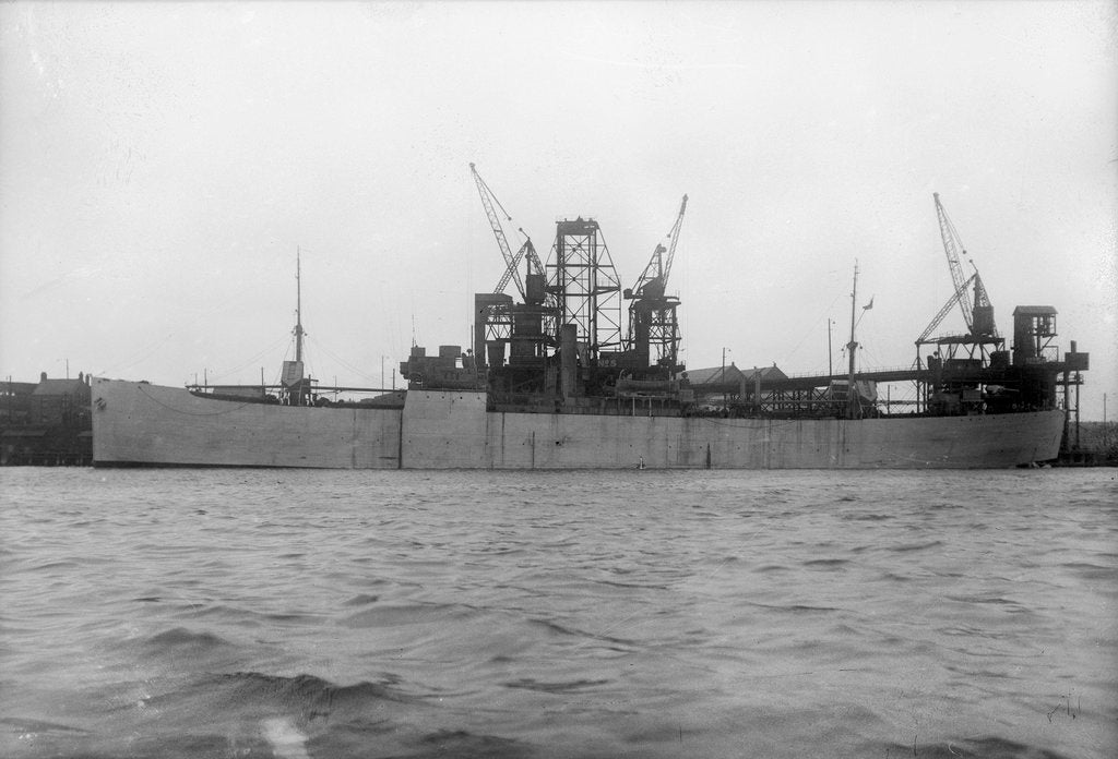 Detail of 'Essex Lance' (Br, 1918) at quayside, under a coal hoist. by unknown