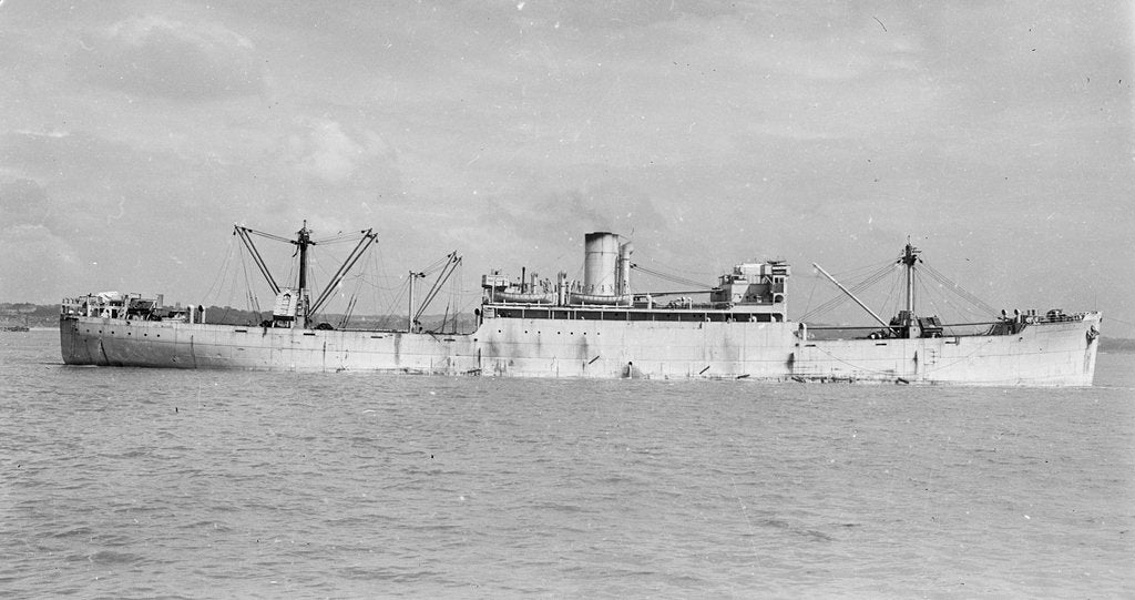 Detail of The 'Manchester Progress' (Br, 1938) under tow in port, topmasts struck by unknown