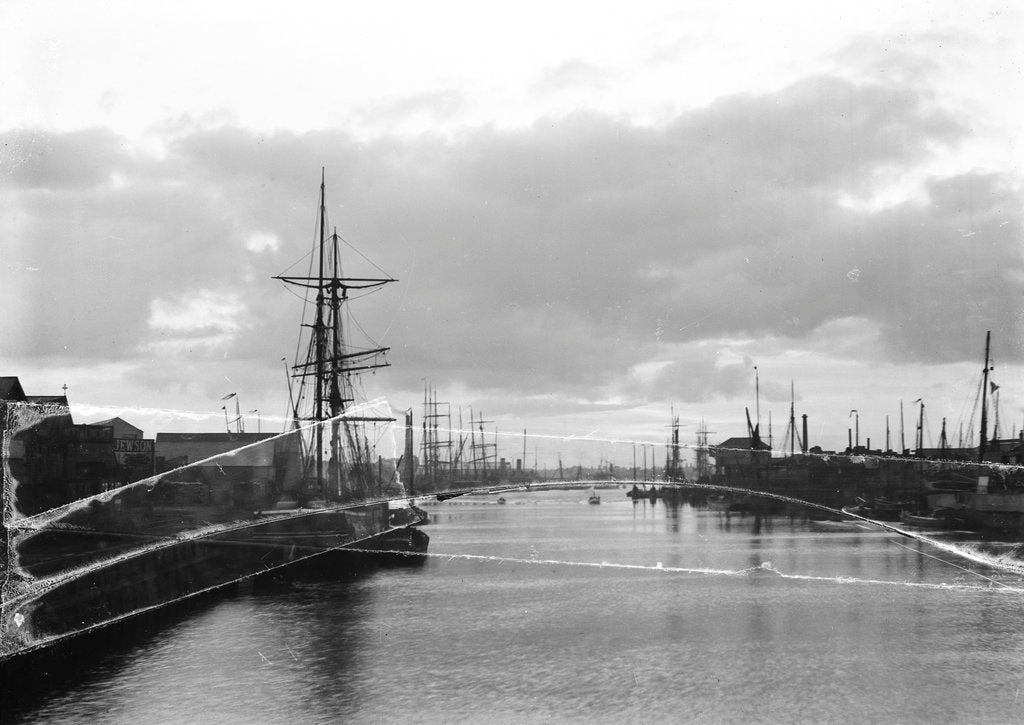 Detail of A view of the inner harbour at sunset from the harbour entrance west of the road bridge at Lowestoft, Suffolk by Smiths Suitall Ltd.