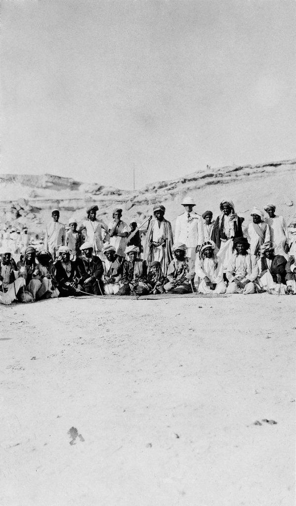 Detail of The Senior Naval Officer, Persian Gulf standing between the Sheikh of Dubai and the Sheikh of Henjam with their entourages. by unknown
