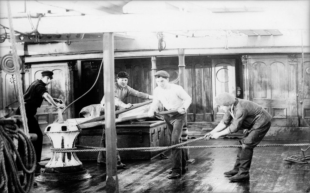 Detail of 'Agda' 3 masted barque, hands manning after the capstan by unknown