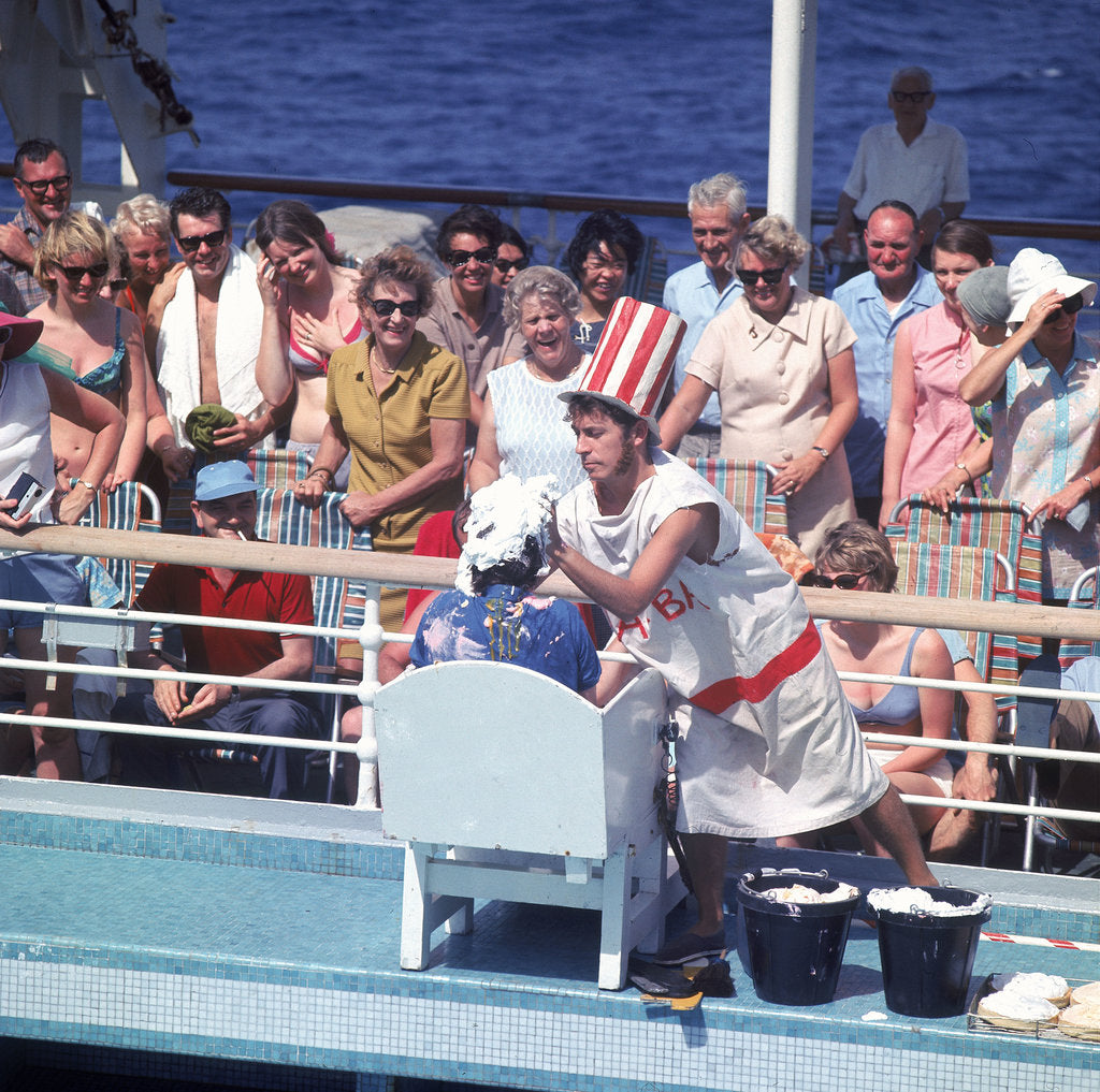 Detail of Comic hijinx aboard an unspecified cruise ship keeps the passengers entertained during the voyage - perhaps a variant of the Crossing the Line (the Equator) ceremony? by Marine Photo Service