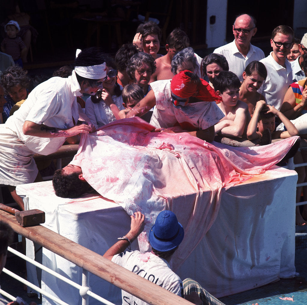 Detail of Macabre comic entertainment aboard an unspecified cruise ship - perhaps a variant of the Crossing the Line (the Equator) ceremony? by Marine Photo Service