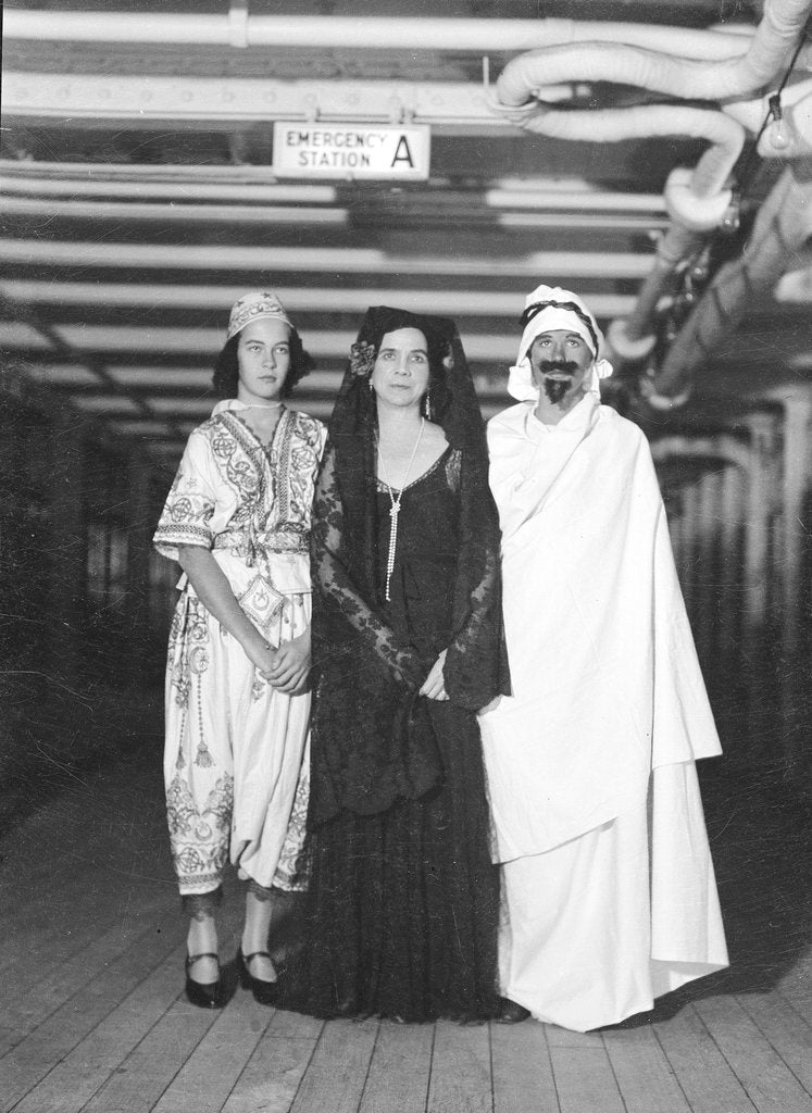 Detail of Passengers dress up in Middle Eastern costume for an obscure tableau aboard an unspecified cruise ship by Marine Photo Service