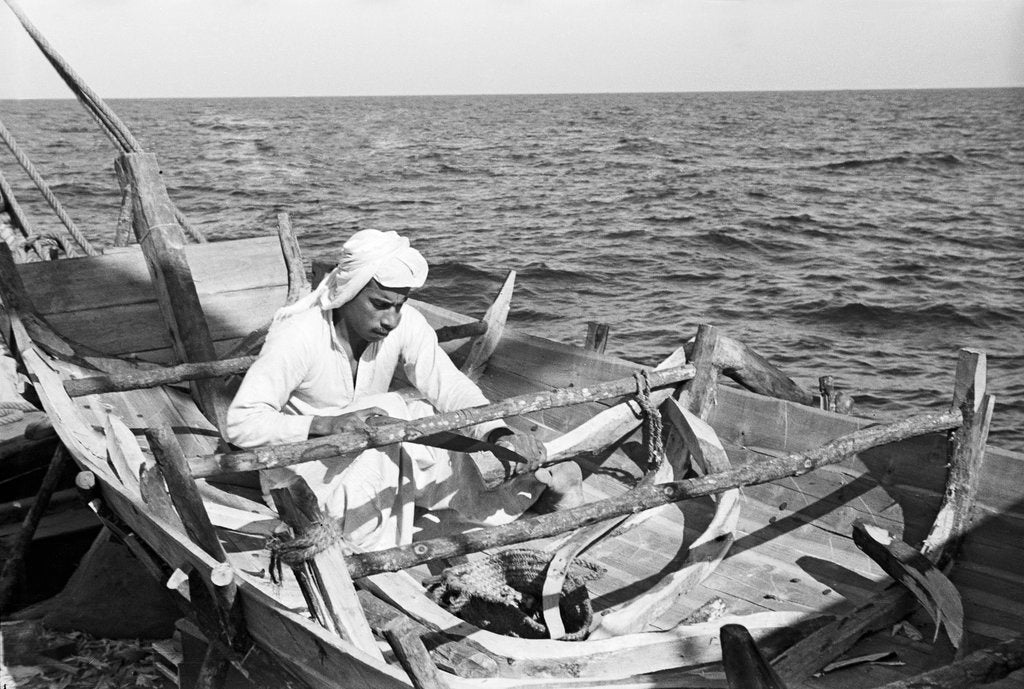 Detail of Carpenter building a small jalboot by Alan Villiers