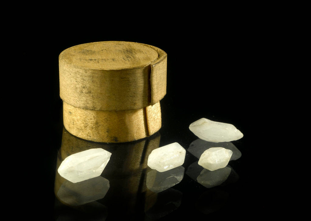 Detail of Pill box containing four cloudy white crystals by Unknown