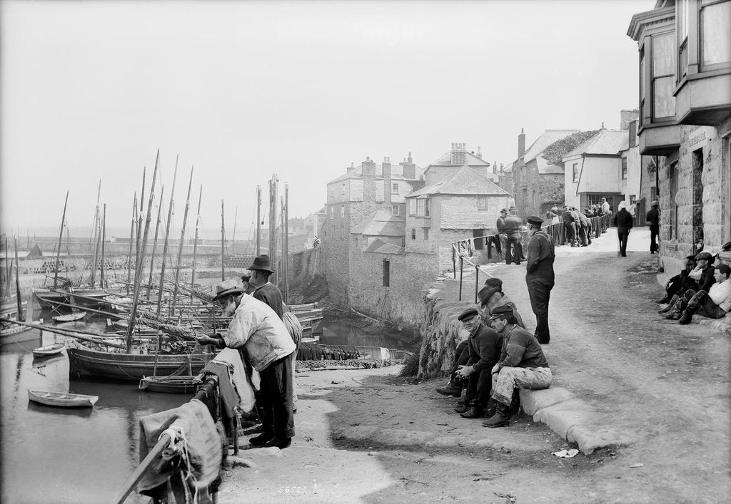 Detail of Newlyn Harbour, Cornwall. The old harbour with fishermen looking out to sea. by Francis Frith & Co.