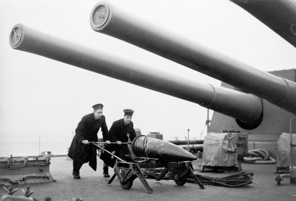 Detail of Two ratings pushing a 14-inch shell on a trolley on the battleship 'King George V' (1939). King George V carried about 800 shells for her 10 guns when loaded. by unknown