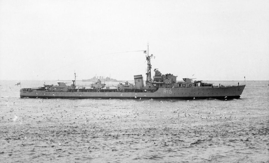 Detail of HMS 'Cavendish' (Br, 1944) under way in the Hamoaze, flying paying off pennant and crew lining deck by unknown