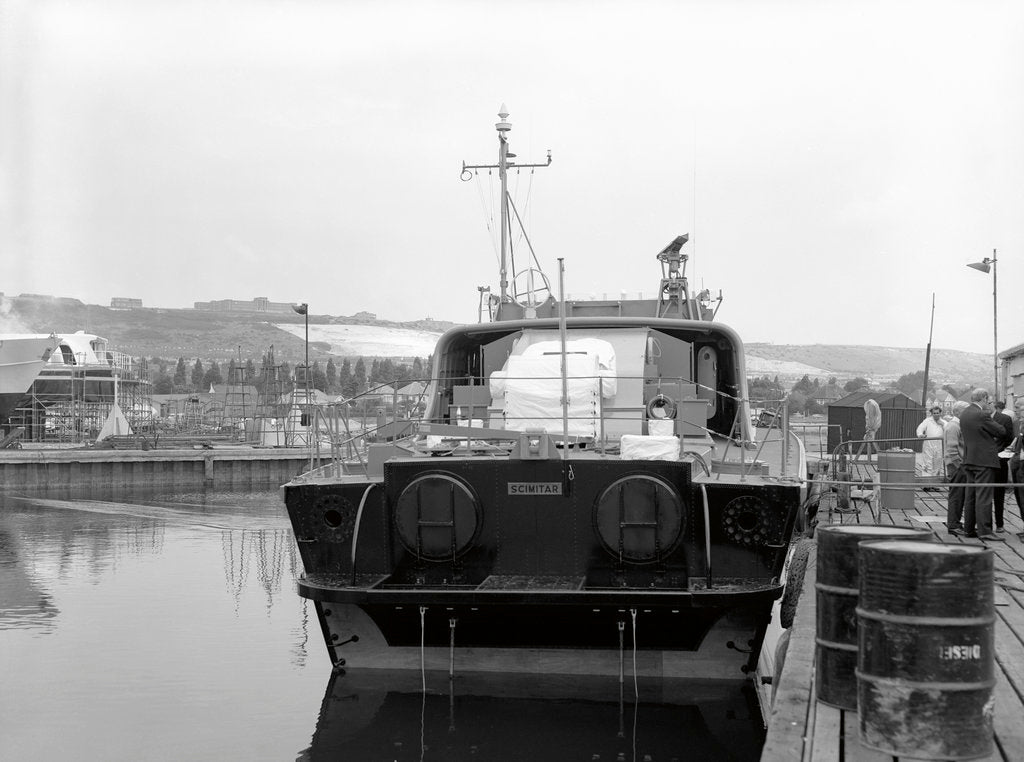 Detail of HMS 'Scimitar' (1969), fast training boat, alongside in the fitting out basin at Vosper's Portchester shipyard by unknown