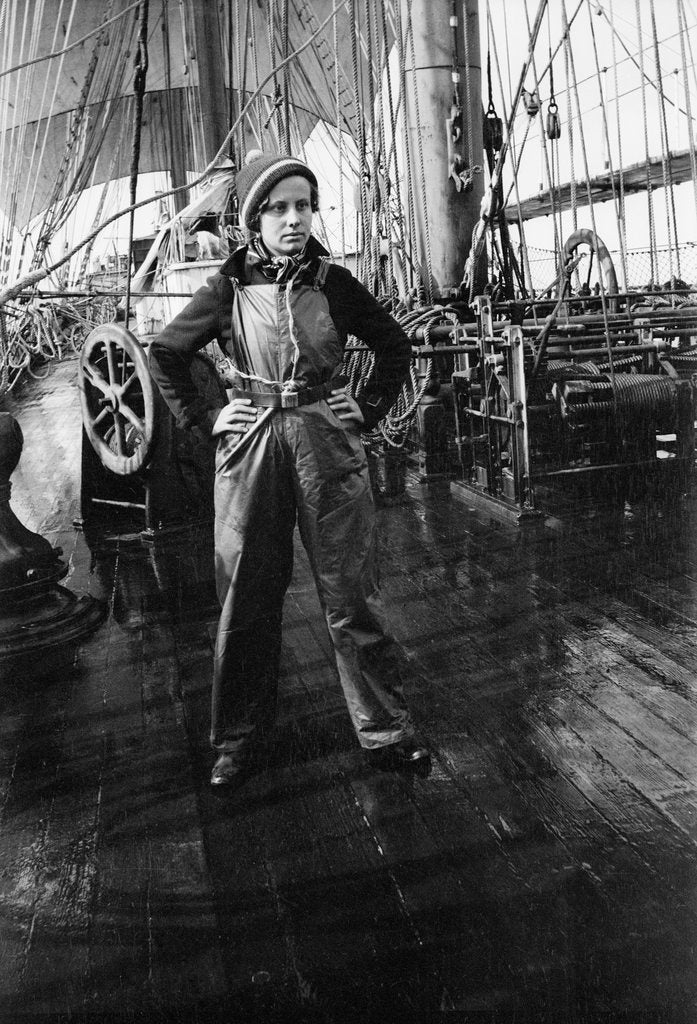 Detail of Elisabeth Jacobsen on deck, in oilskins, aboard 4 masted barque 'Parma' (Fi, 1902), ex 'Arrow' (Ruben de Cloux) by Alan Villiers