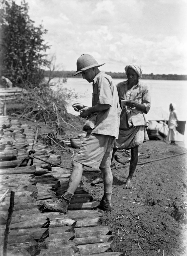 Detail of A British government official checking mangrove poles by Alan Villiers