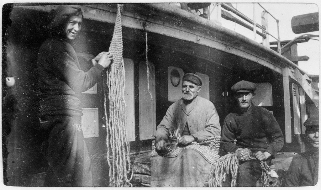 Detail of Apprentice Williams and others making sennit mats aboard 3 masted ship 'Zealandia' (Br, 1869), Shaw, Savill & Albion Co Ltd by unknown