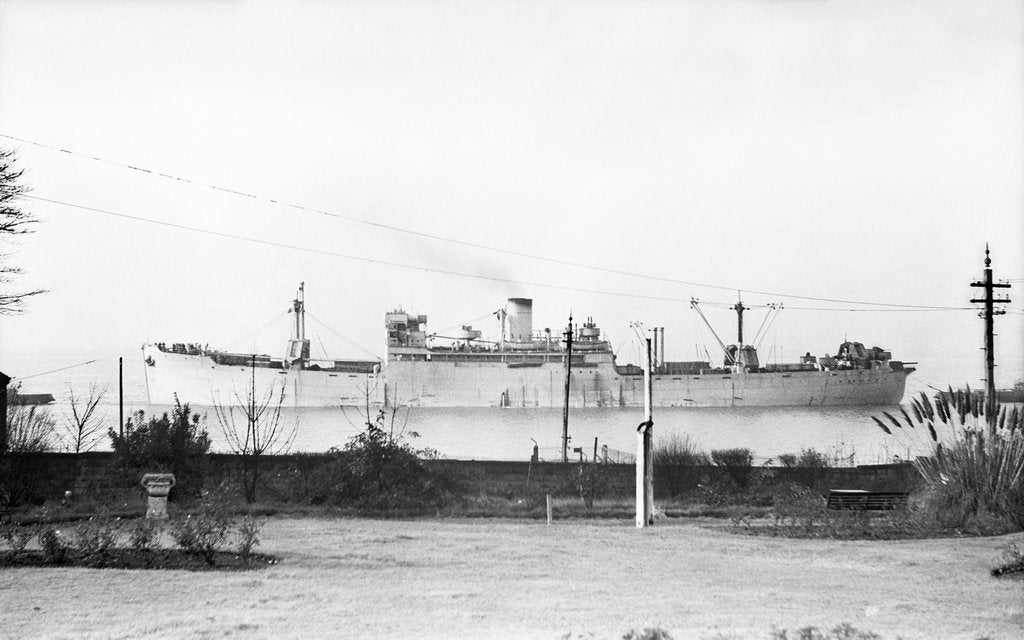 Detail of Cargo liner 'Manchester Port' (1935) under tow with topmasts struck by unknown