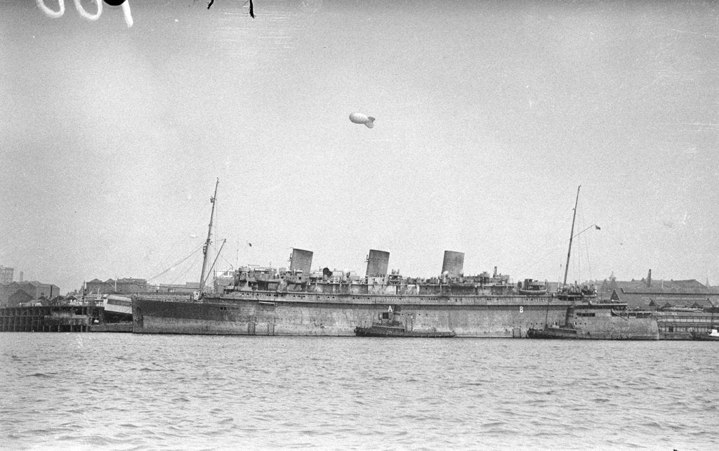 Detail of 'Monarch of Bermuda' (1931) alongside in the River Mersey in 1942-1943, probably refitting as a mercantile LSI(L) by unknown