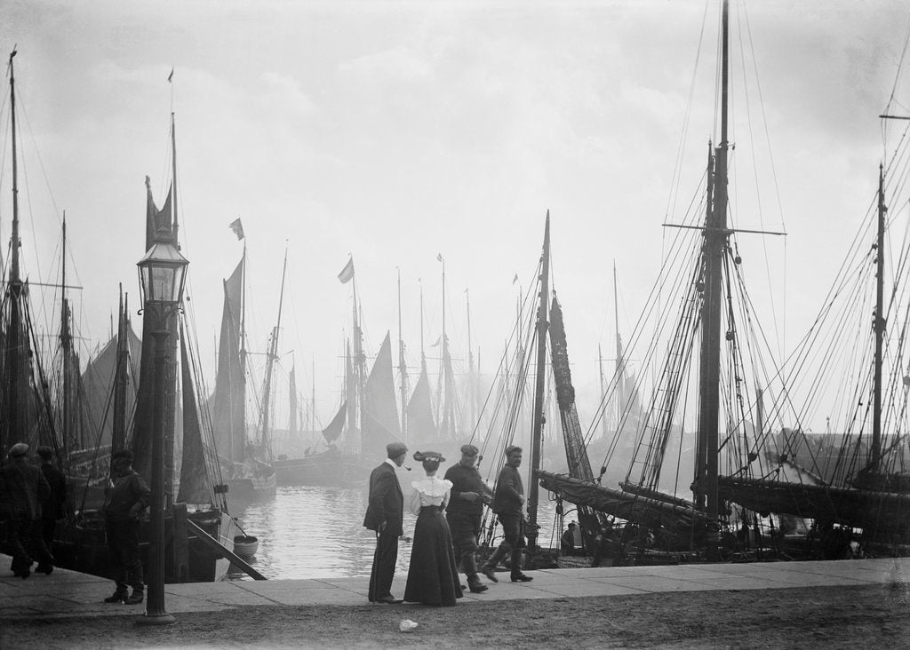 Detail of Trawlers berthed in the outer harbour with the morning mist rising at Lowestoft, Suffolk by Smiths Suitall Ltd.