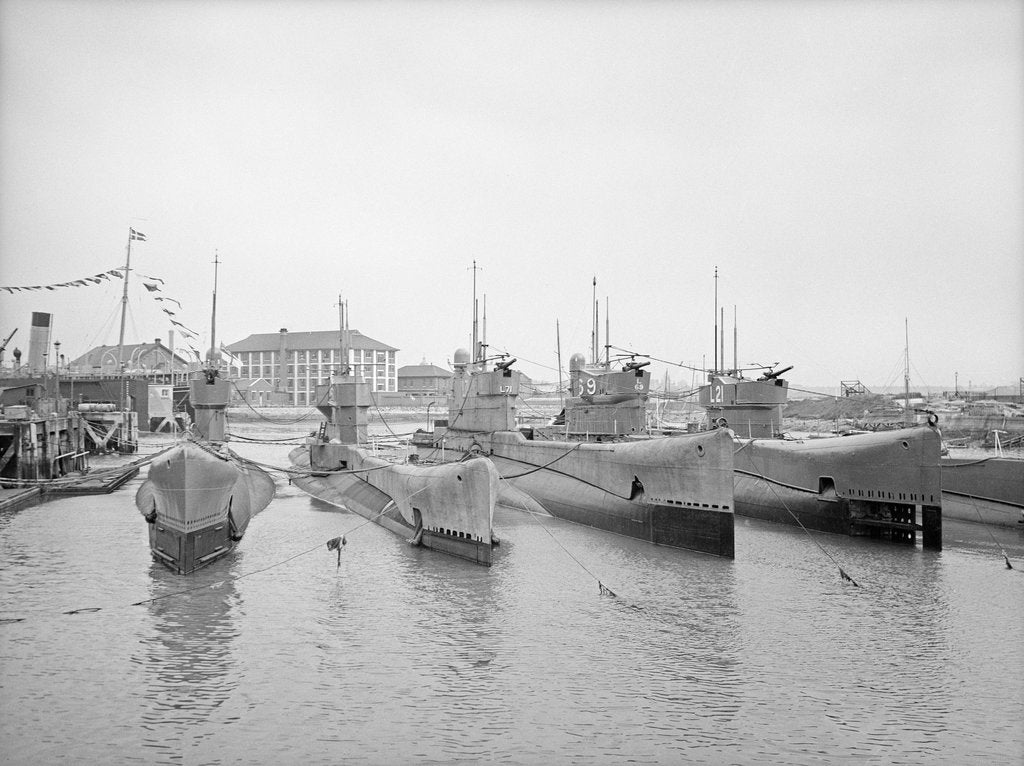 Detail of HMS Submarine 'L71' (1919), berthed at HMS 'Dolphin', Haslar Creek, with 'L56' (1919) and 'L53' (1919) inboard and 'L69' (1918) and 'L21' (1919) outboard by unknown