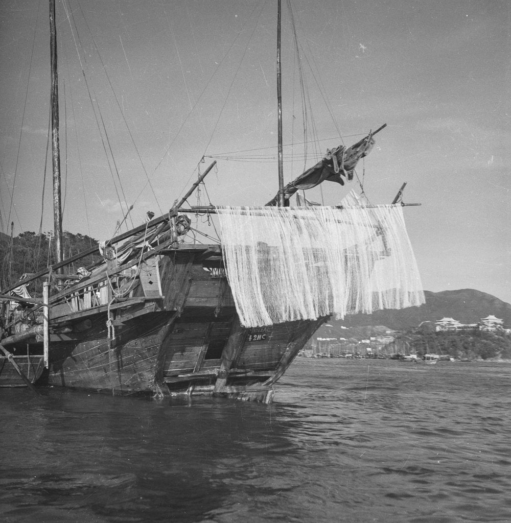Detail of A port quarter view of an Aberdeen frame stern fisher type junk in Hong Kong harbour by David Watkin Waters