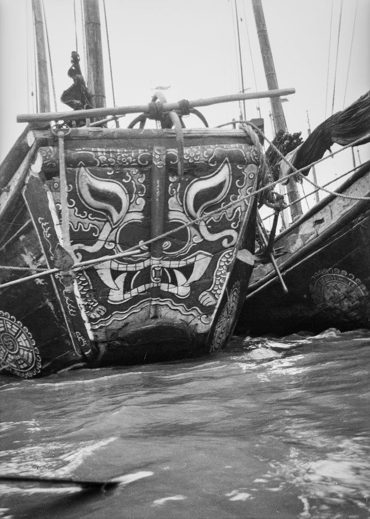 Detail of The highly decorative bow of a Hangchow Bay trader type junk moored with other junks at Shanghai by David Watkin Waters