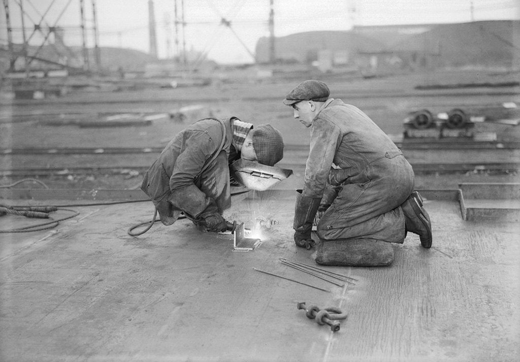 Detail of Robert the Bruce. Two welders at work aboard the vessel. by unknown