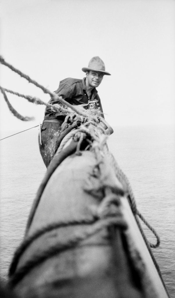 Detail of Seaman and photographer Alan Villiers on a yard with camera by unknown