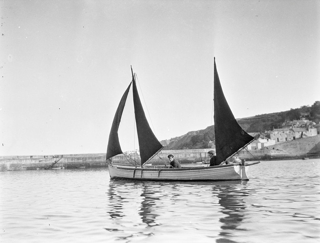 Detail of Mounts Bay pilot gig, under sail in Newlyn harbour, setting fore staysail and standing lugs with booms on fore and mizzen masts by unknown
