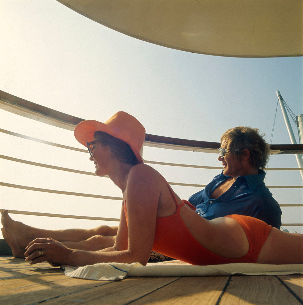 Detail of A couple relax and enjoy the sea view on board an unspecificed cruise liner by unknown