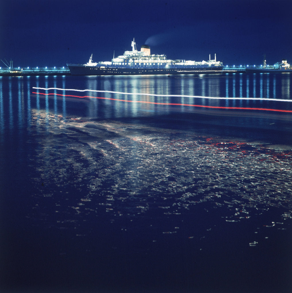 Detail of A night shot of an unspecified cruise liner under way by Marine Photo Service